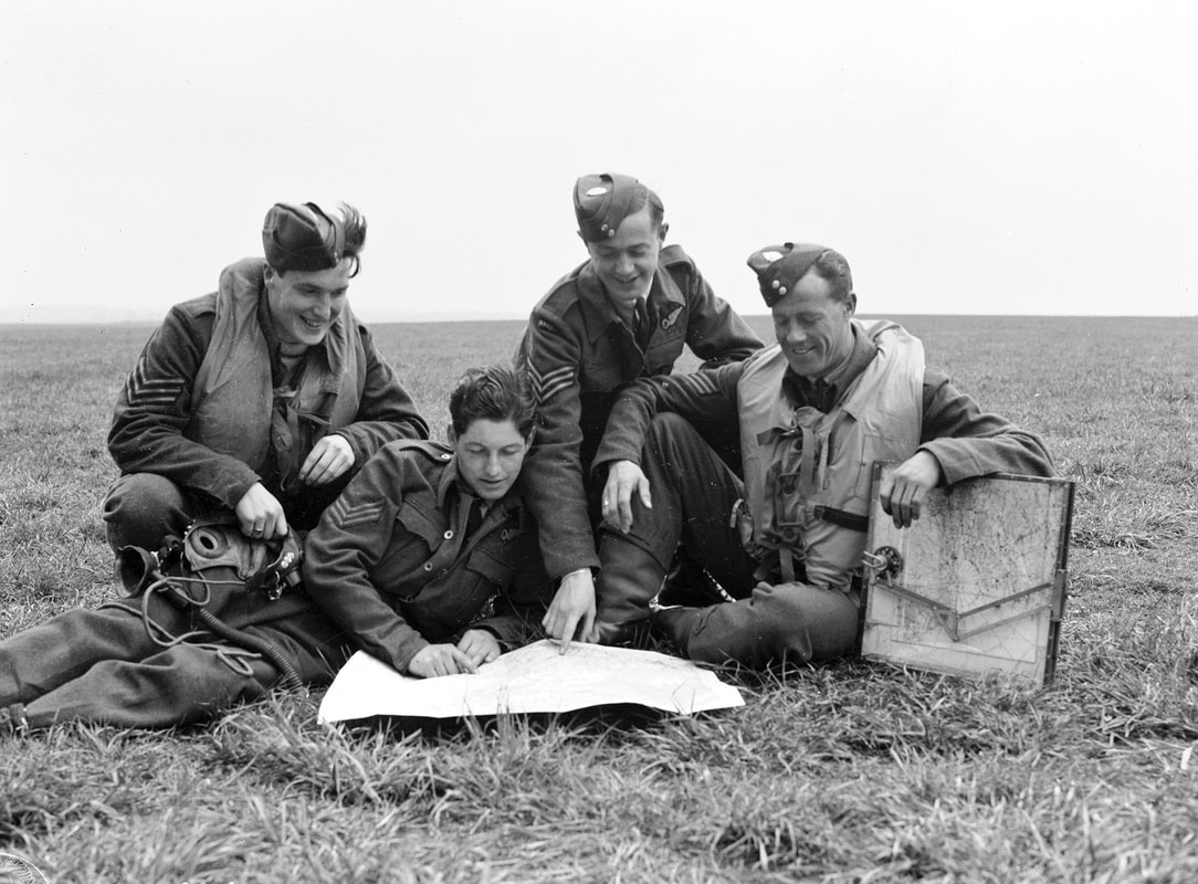 404 Sqn navigators with navigator's table and map