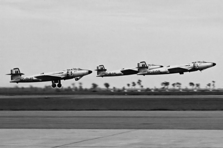 A trio of 423 Squadron Mark 3 Avro CF-100s depart St. Hubert during an Open House.